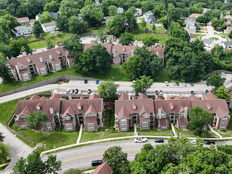 A bird's eye view of a neighborhood with houses and cars.