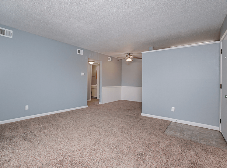 Indian Hills Apartments living room with carpeting