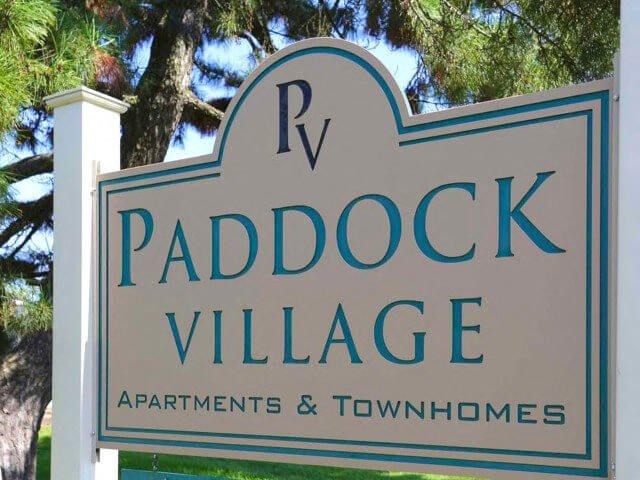 Welcome sign for Paddock Village!