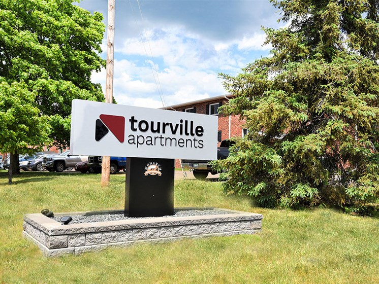 sign located outside tourville apartments
