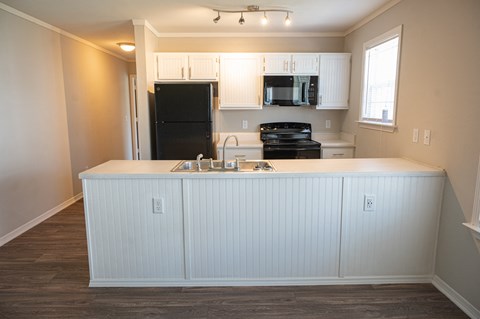 Beautiful kitchen in Deerbrook Apartment homes with spacious countertops and overhead lighting