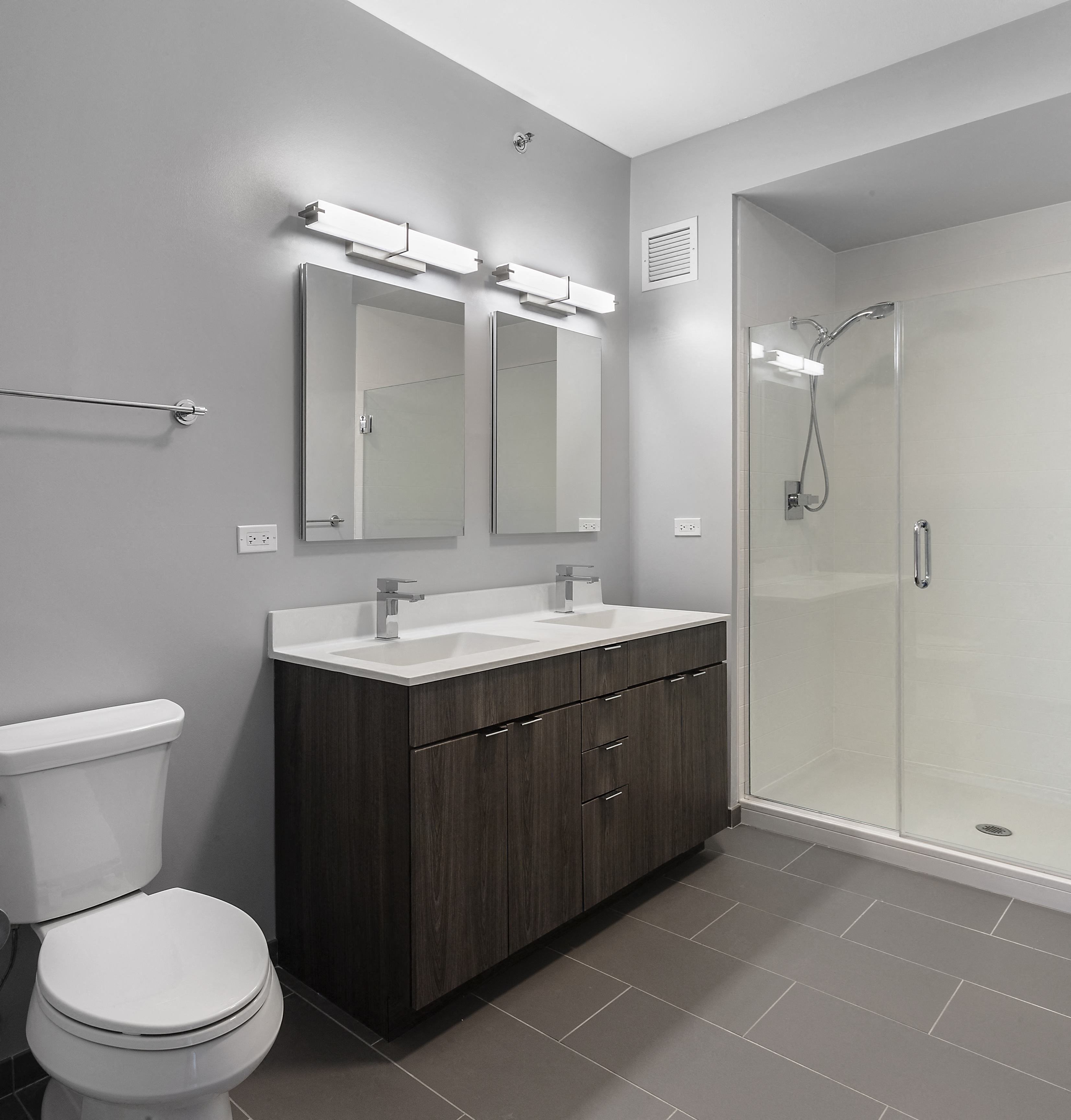 bathroom with toilet sink and shower at Residences at Addison Clark Apartments, Chicago, IL, 60613