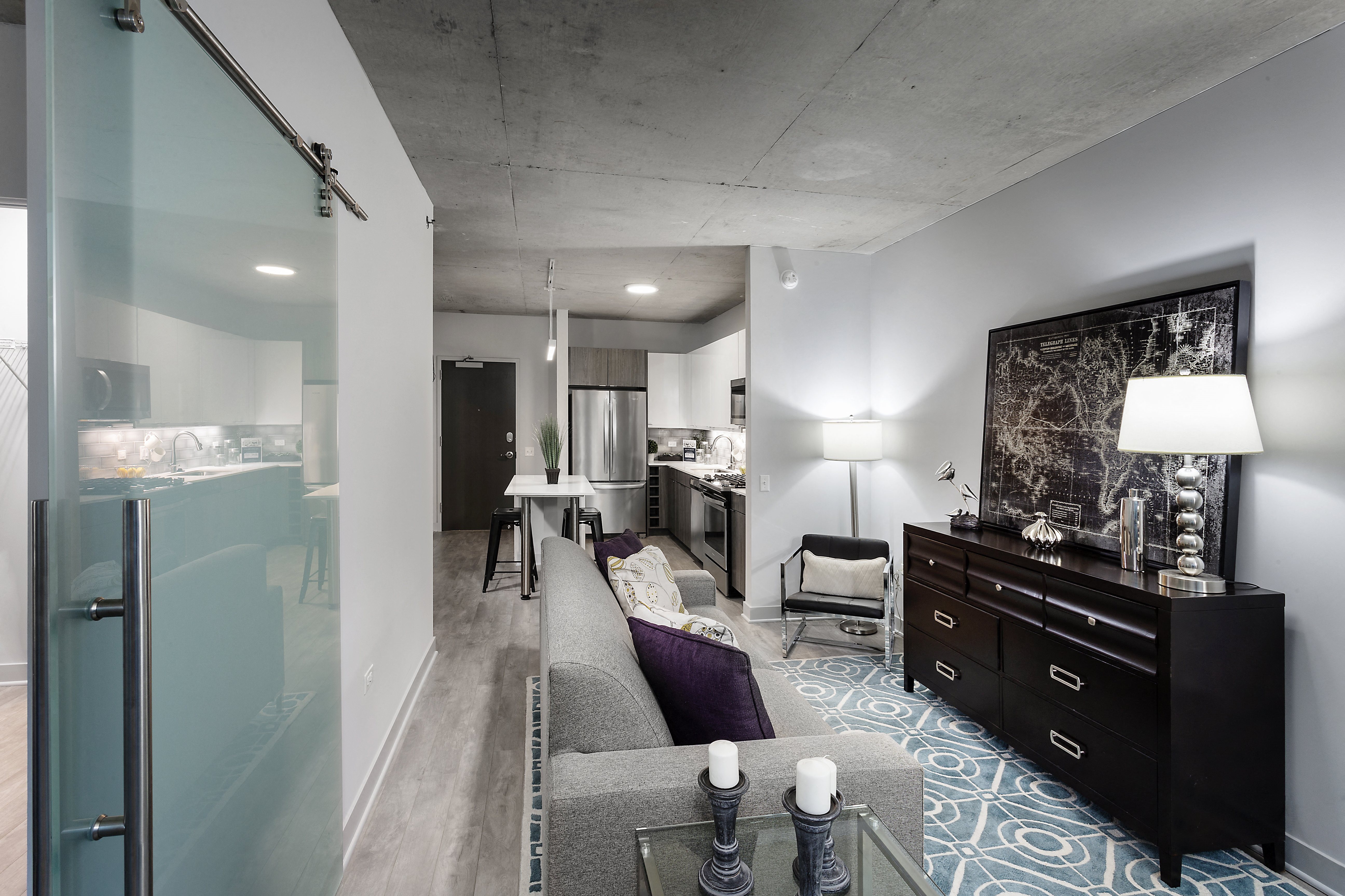 a living room and kitchen in a studio apartment at Residences at Addison Clark Apartments, Chicago, IL, 60613
