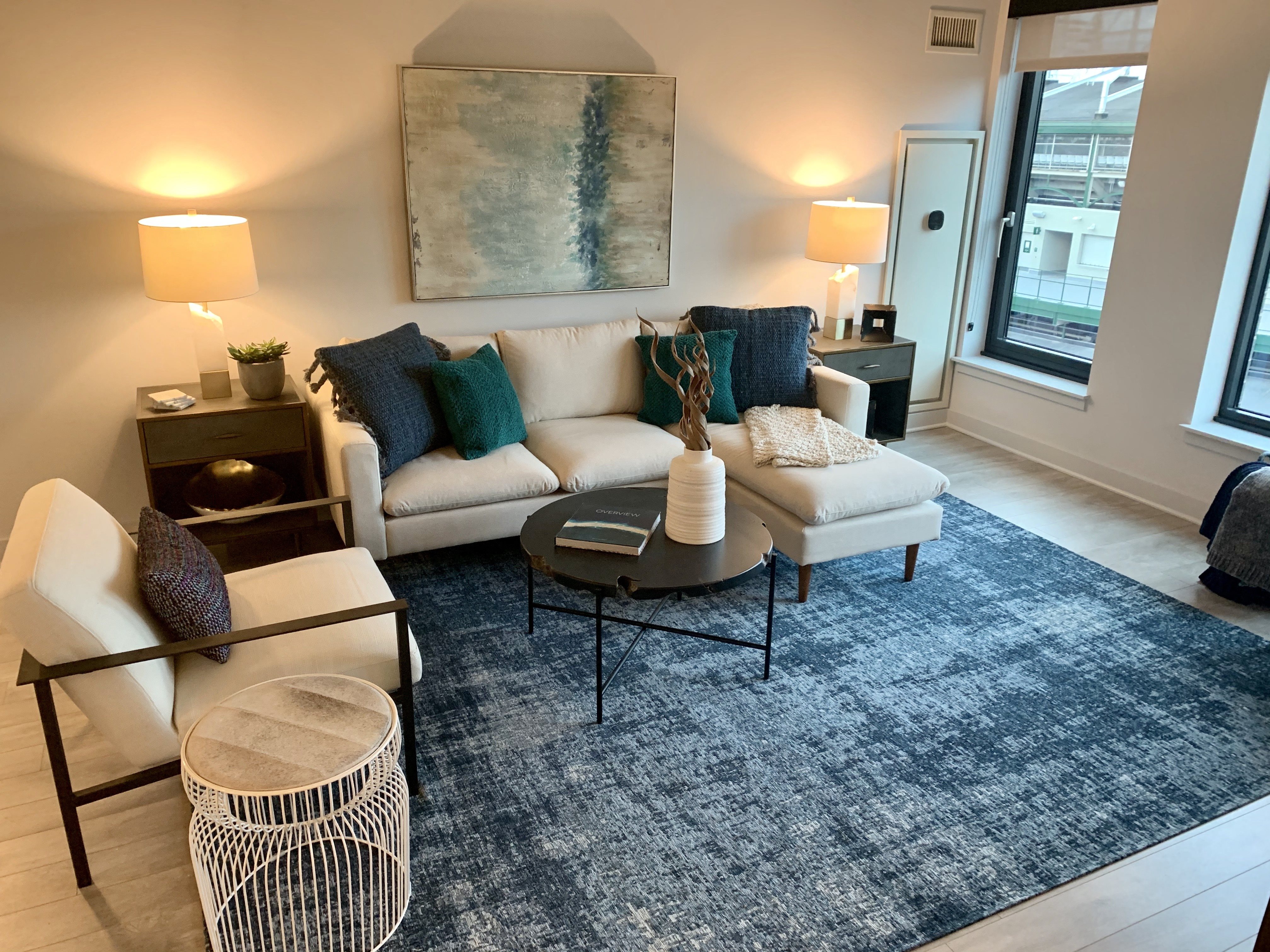 a living room with a couch and a rug at Residences at Addison Clark Apartments, Chicago, 60613