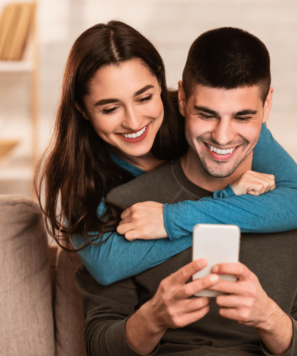 The Retreat at Indian Lake affordable apartment homes program image of a woman hugging a man