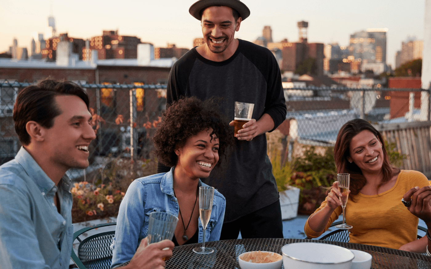 Friends having dinner on a rooftop