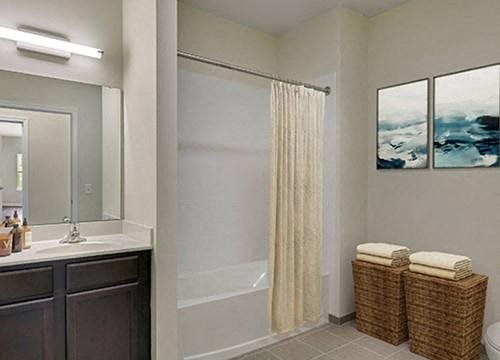a bathroom with a shower and a sink and a mirror