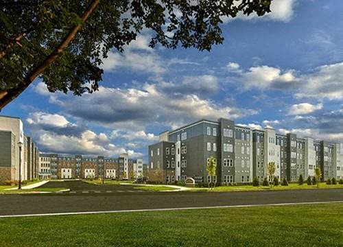 a rendering of an apartment building on a city street