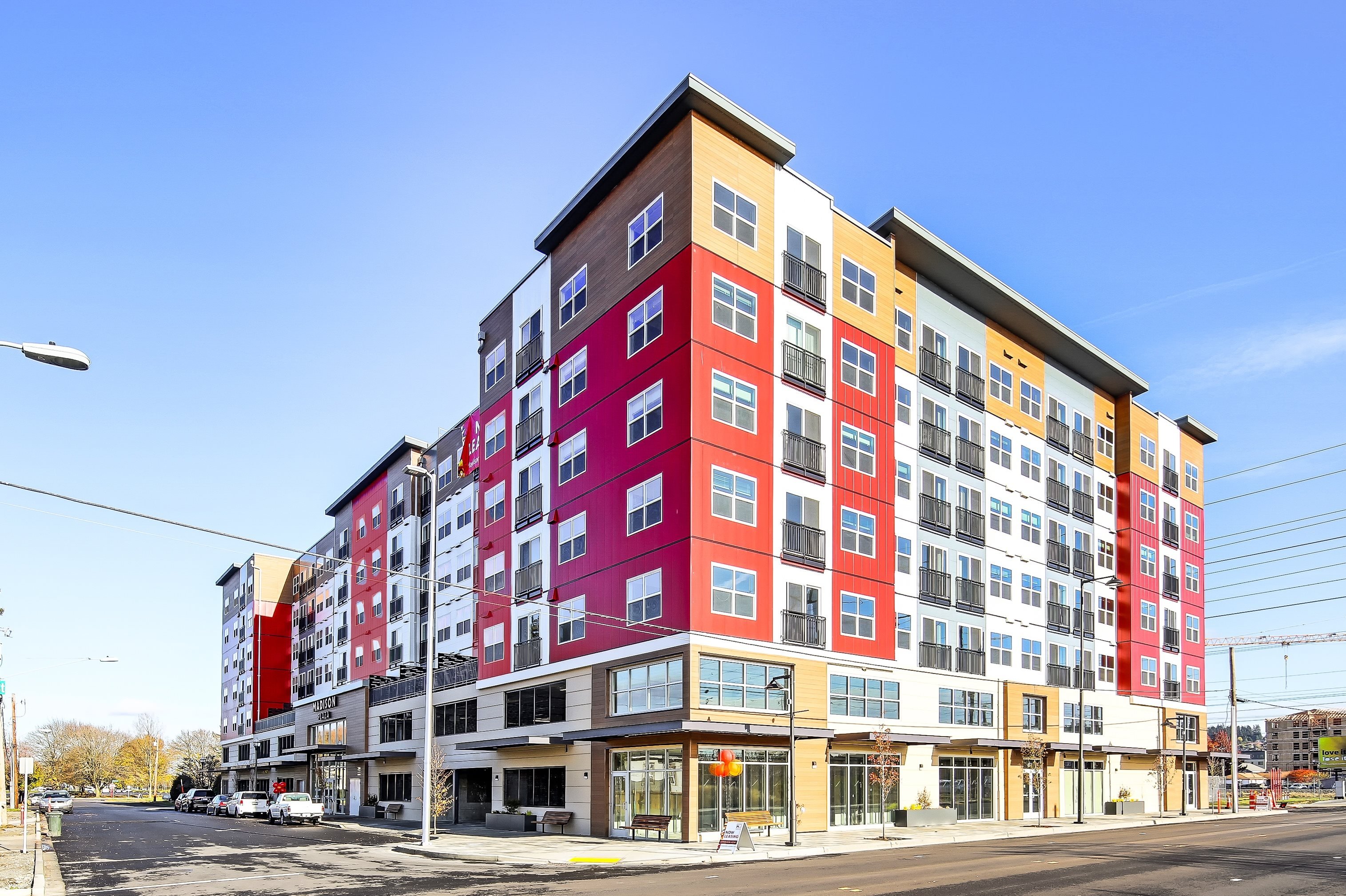 a new apartment building on the corner of a city street