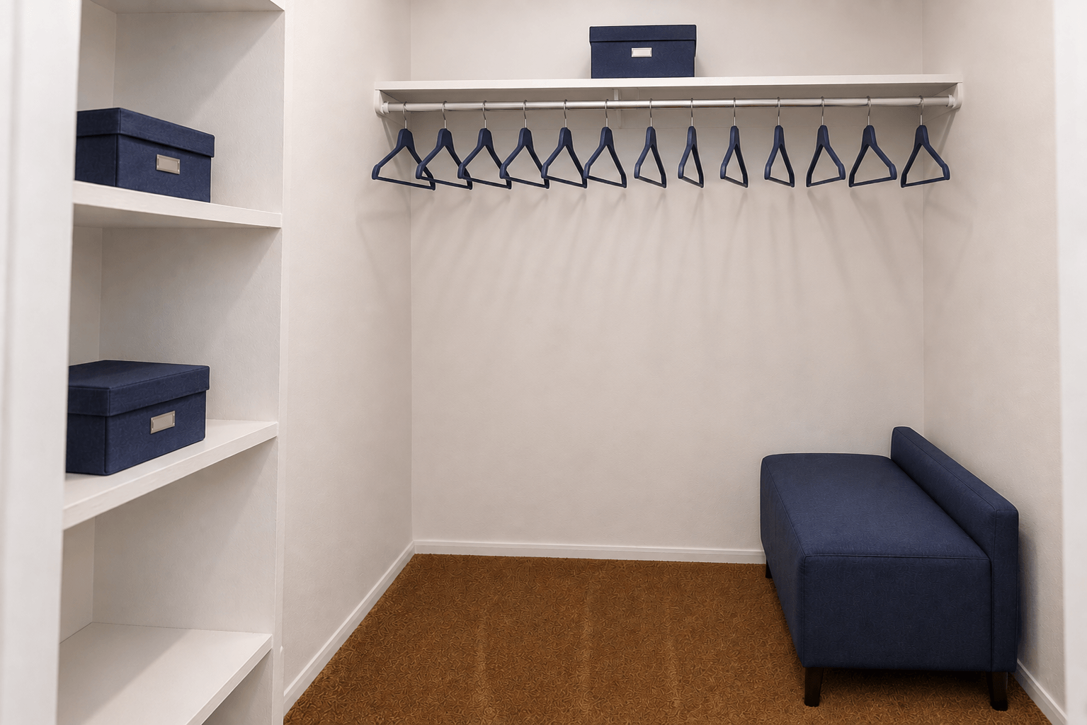 A white closet with a bench and a coat hanger.