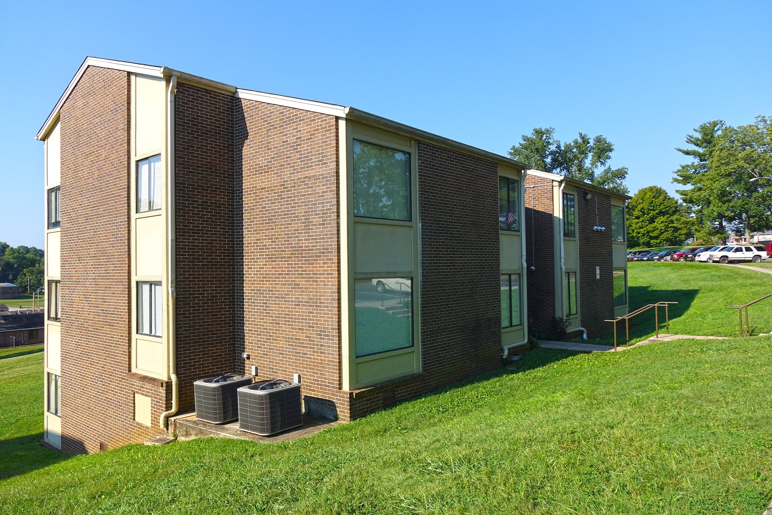 a row of modular housing units in a grassy area