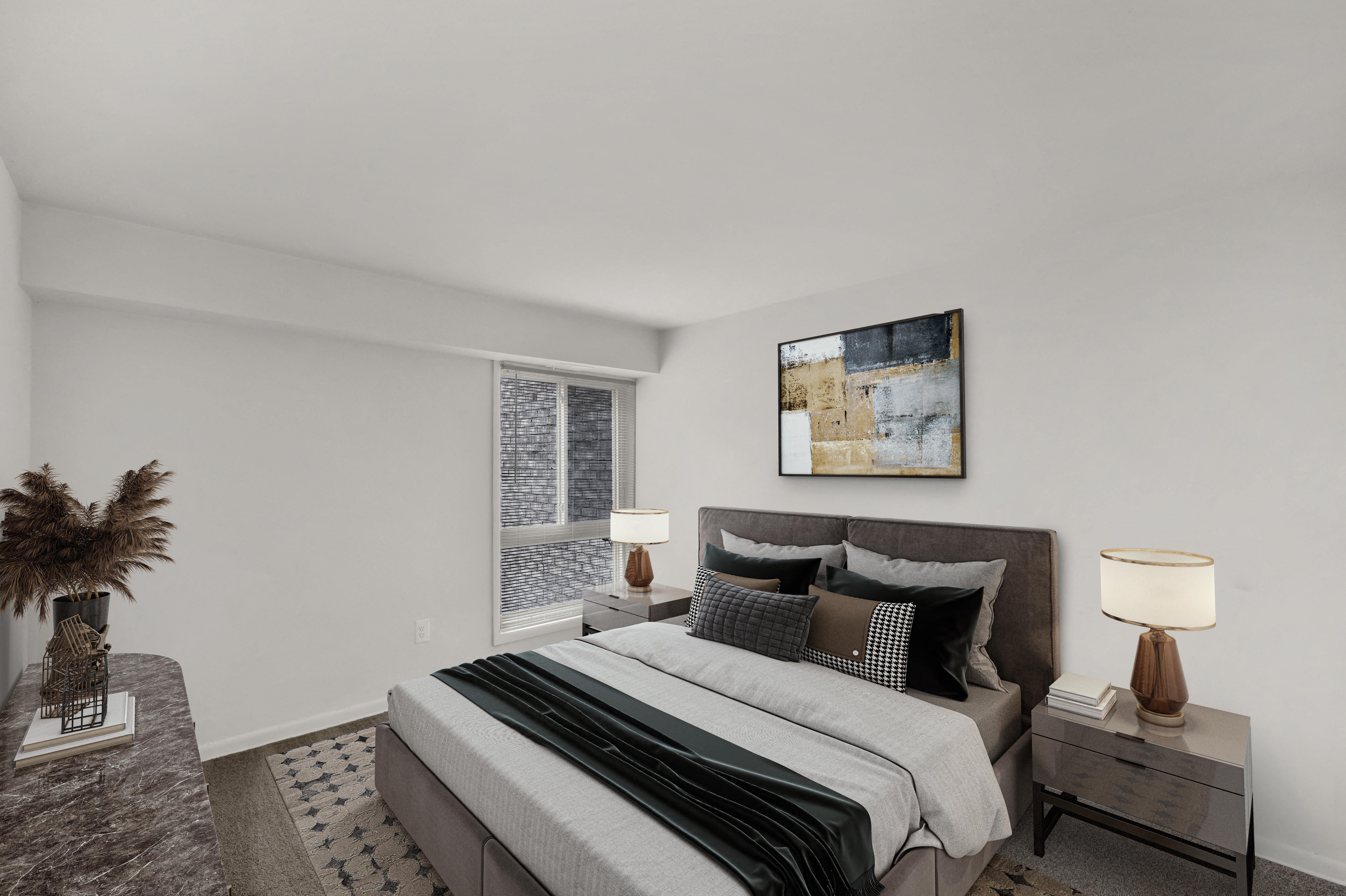 a bedroom with a large bed and a large window