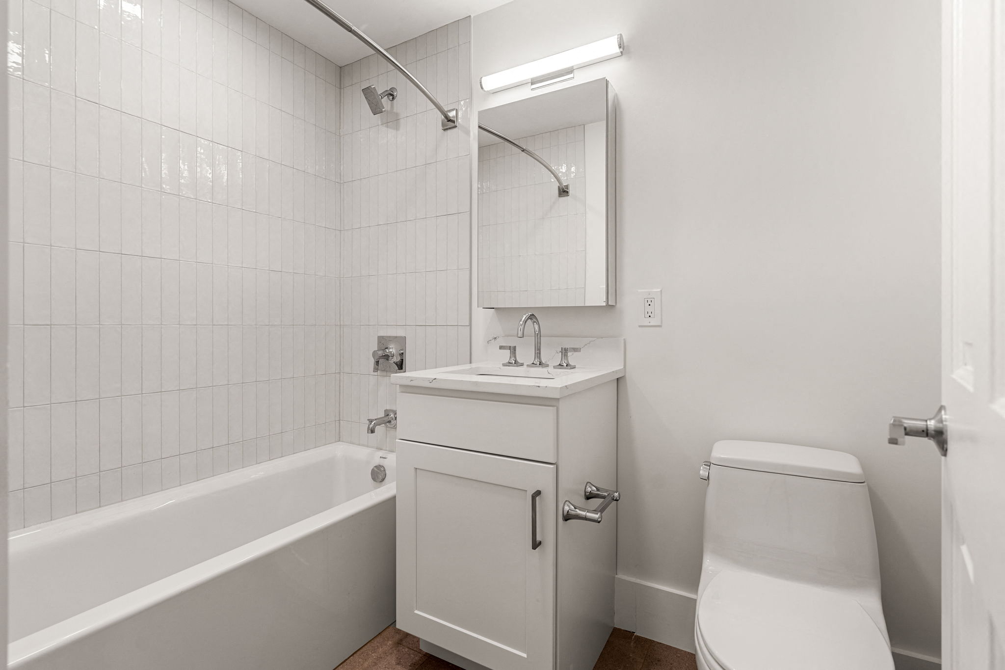 a bathroom with a sink toilet and a bath tub