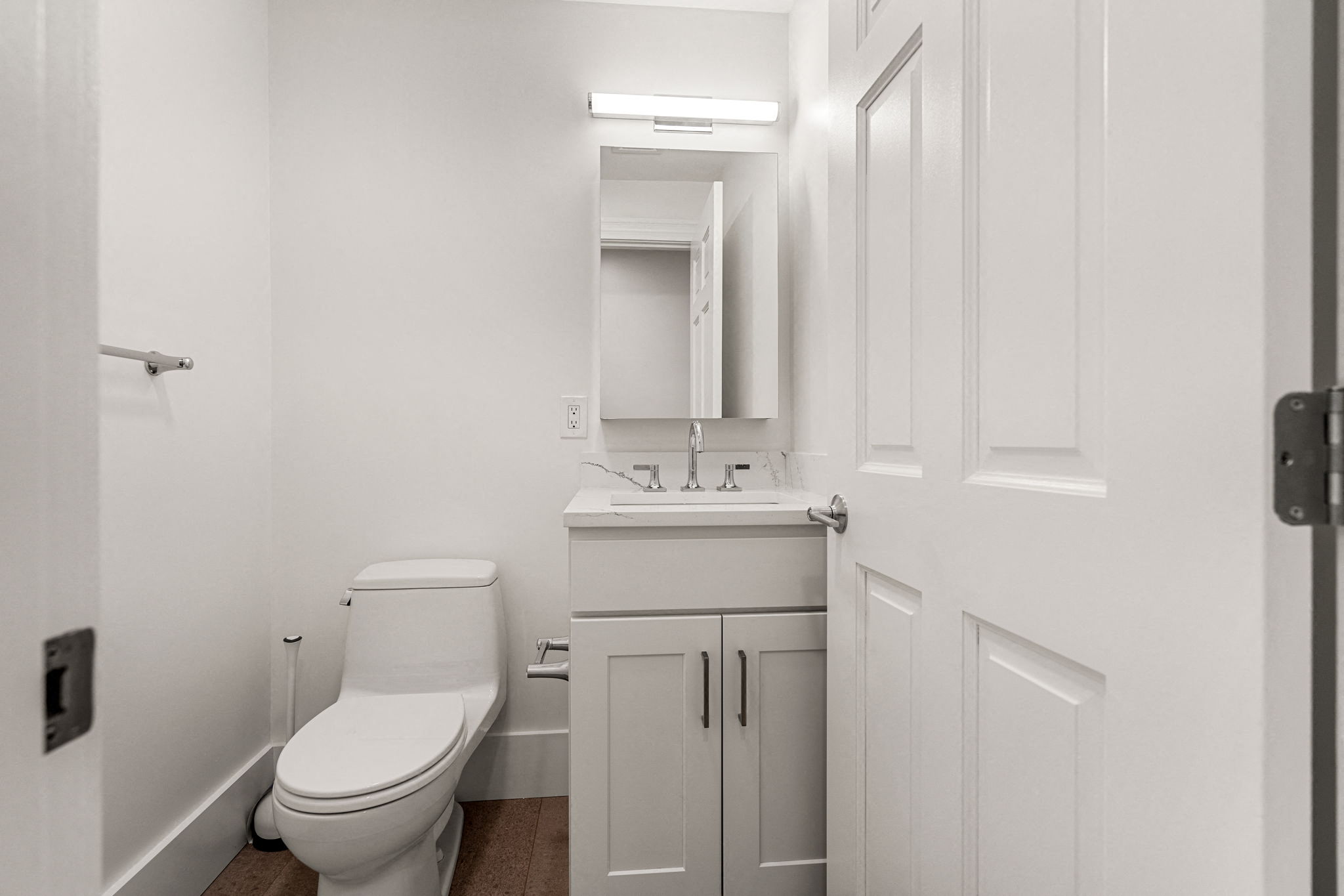 a bathroom with a sink toilet and a mirror