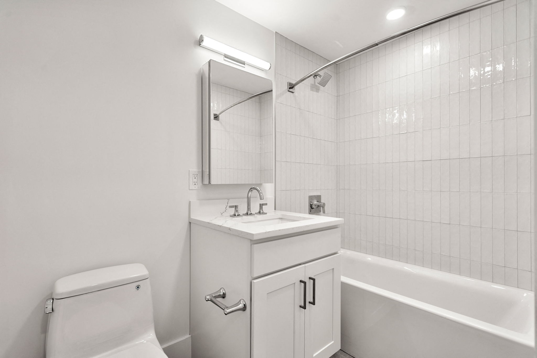 a bathroom with a sink and a toilet and a bath tub
