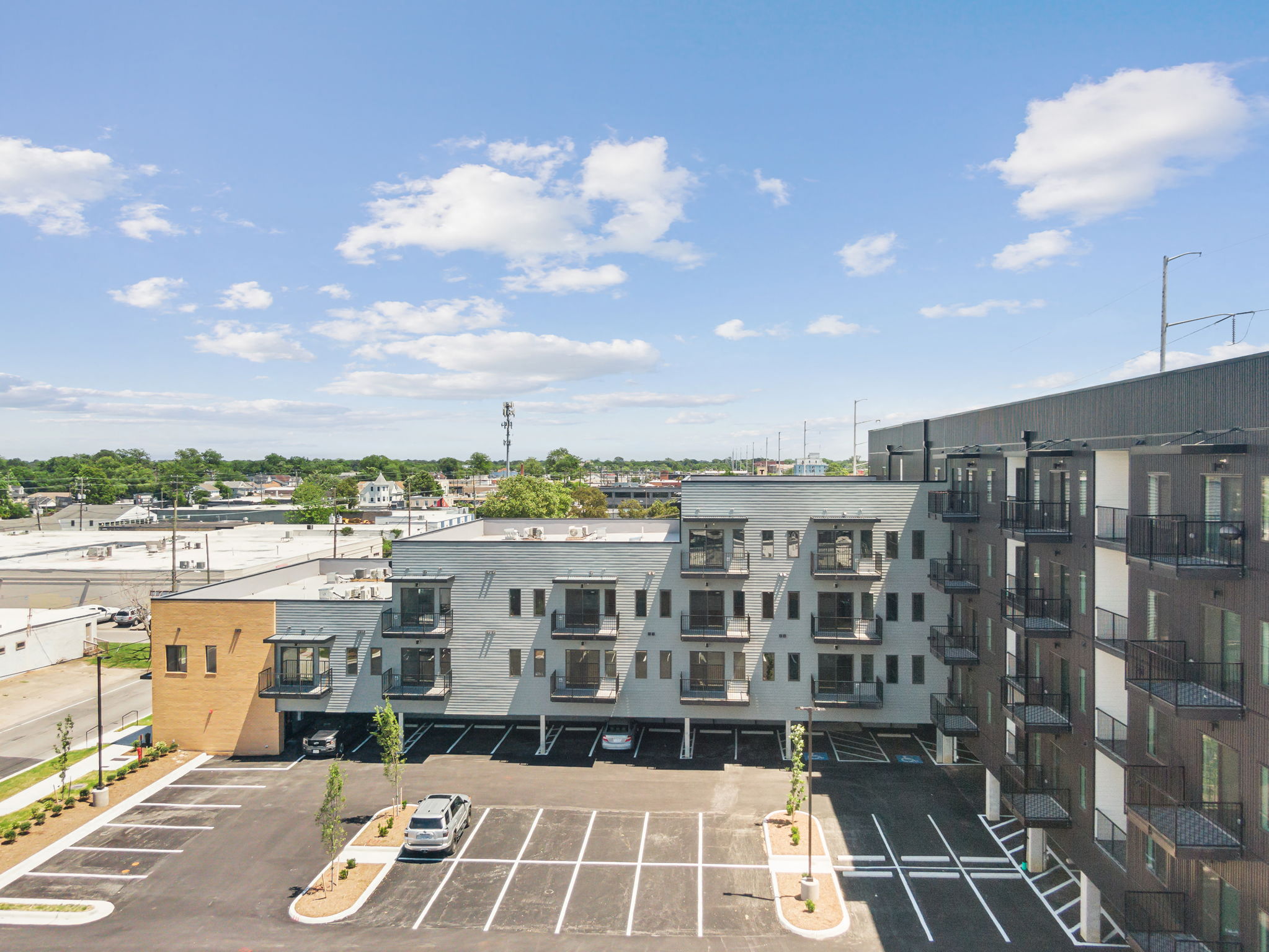 the view of an apartment parking lot from above