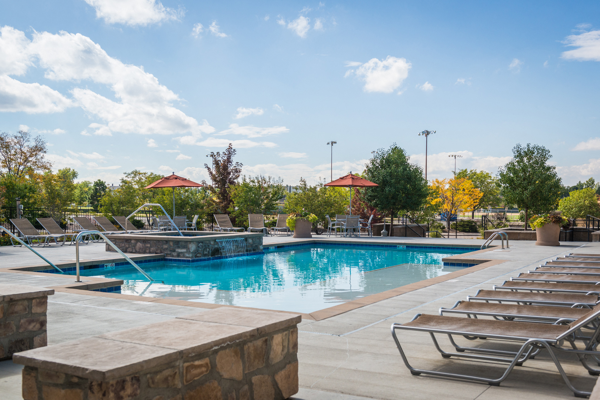 Swimming pool with sun deck at Arterra Place Apartments, Colorado