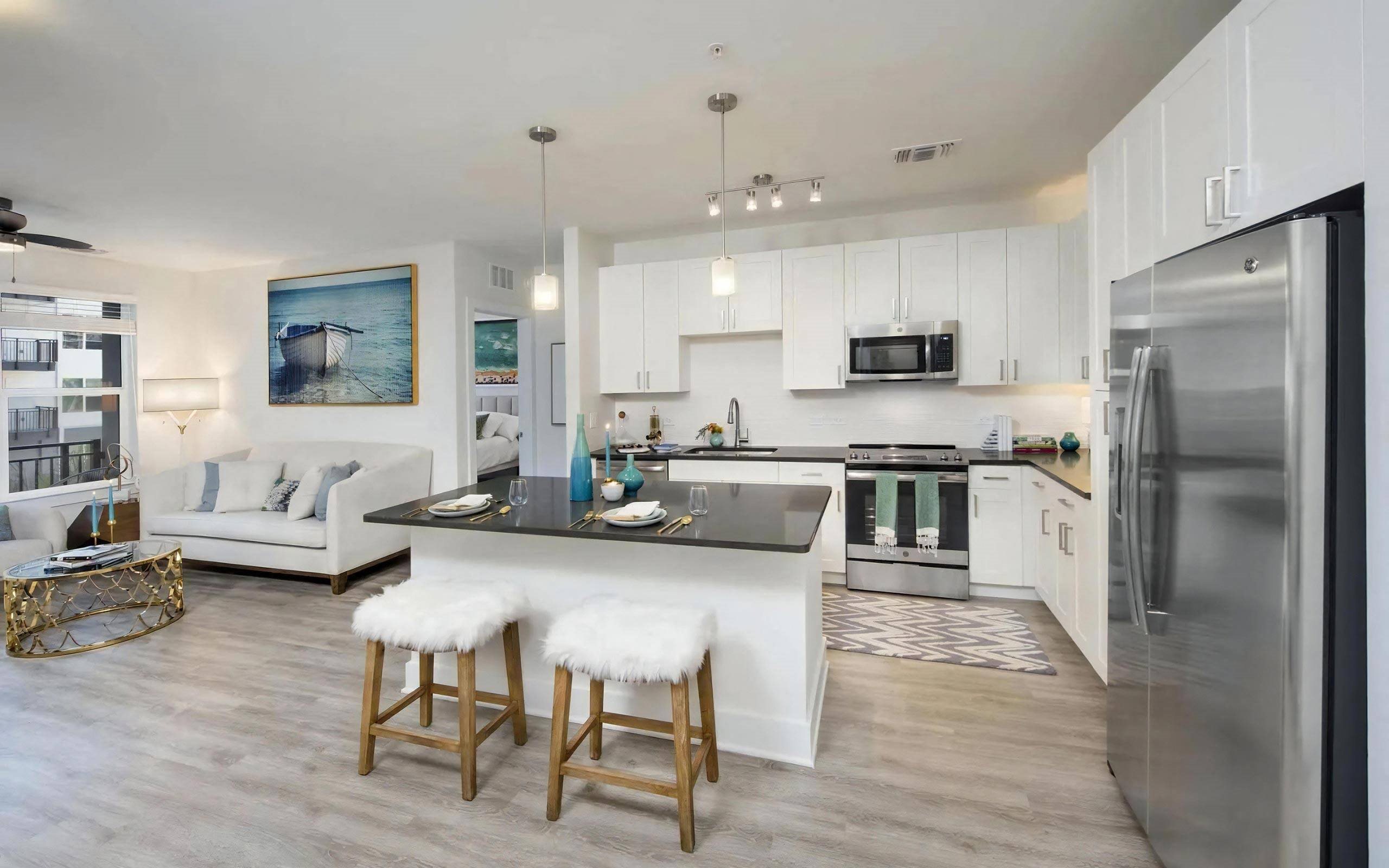 Open-Concept Living and Kitchen Area with Sleek White Cabinetry