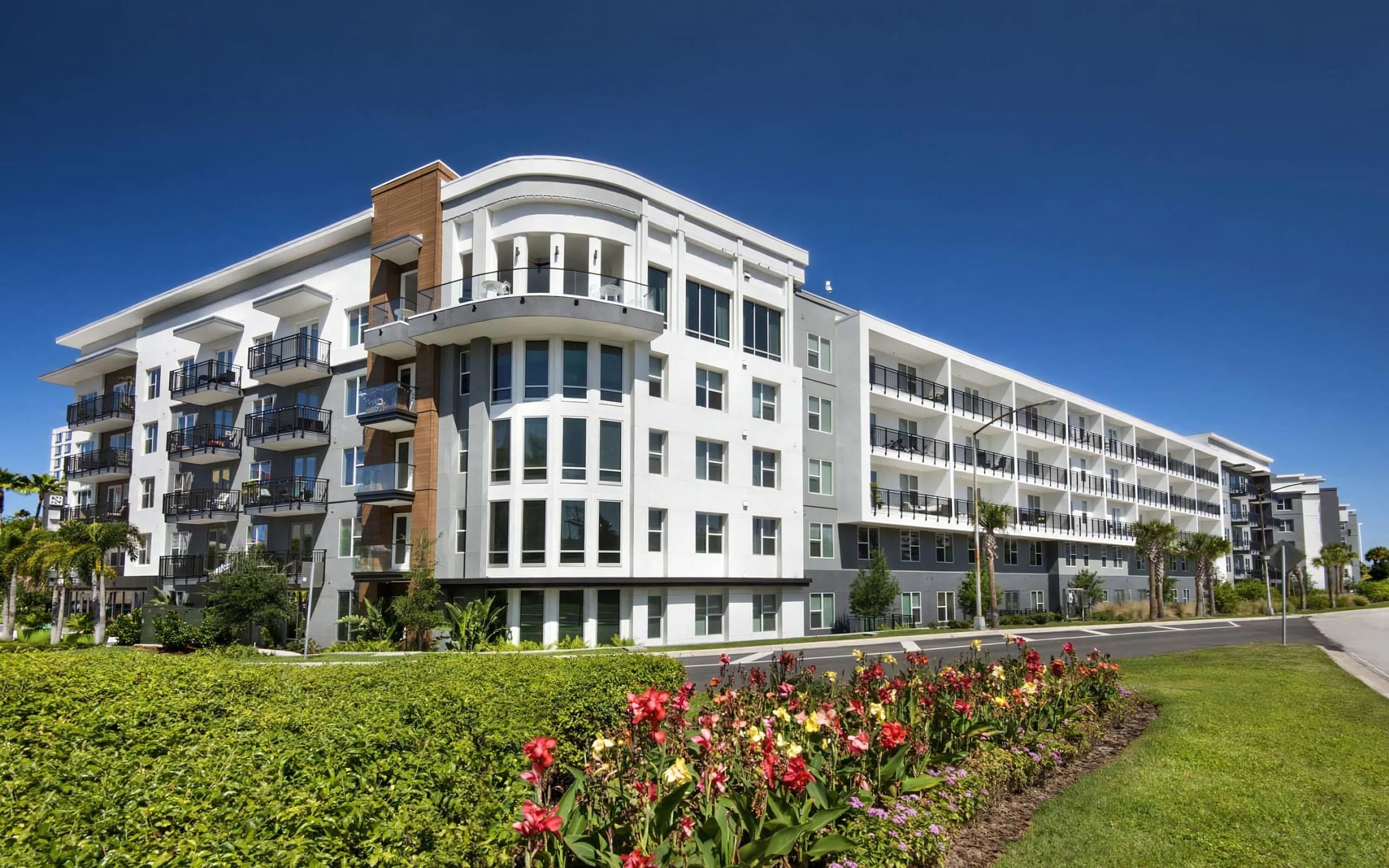 Anchor Riverwalk Apartment Community with Landscaped Grounds and Corner Window Design