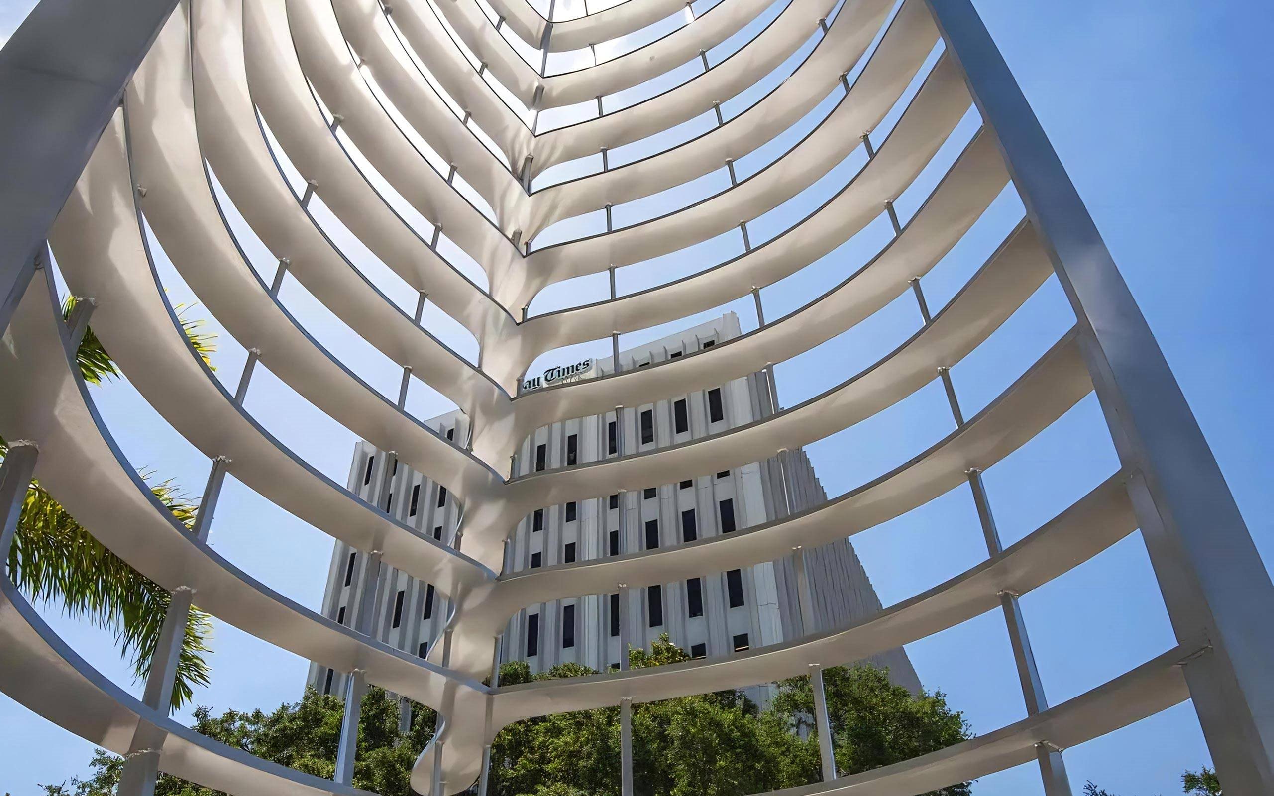 Artistic Metal Sculpture Outside Anchor Riverwalk with View of Downtown Landmark