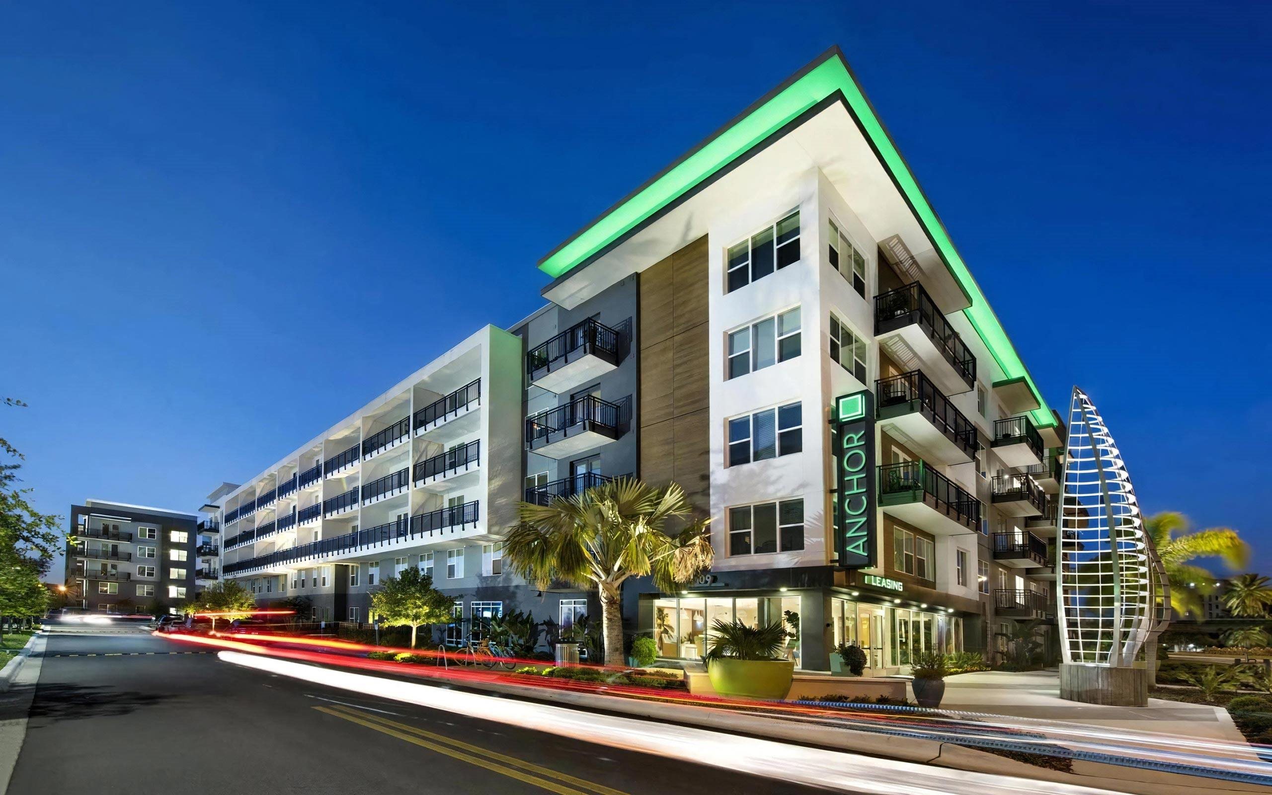 Anchor Riverwalk Entrance Featuring Illuminated Sculpture and Modern Leasing Center with Sign