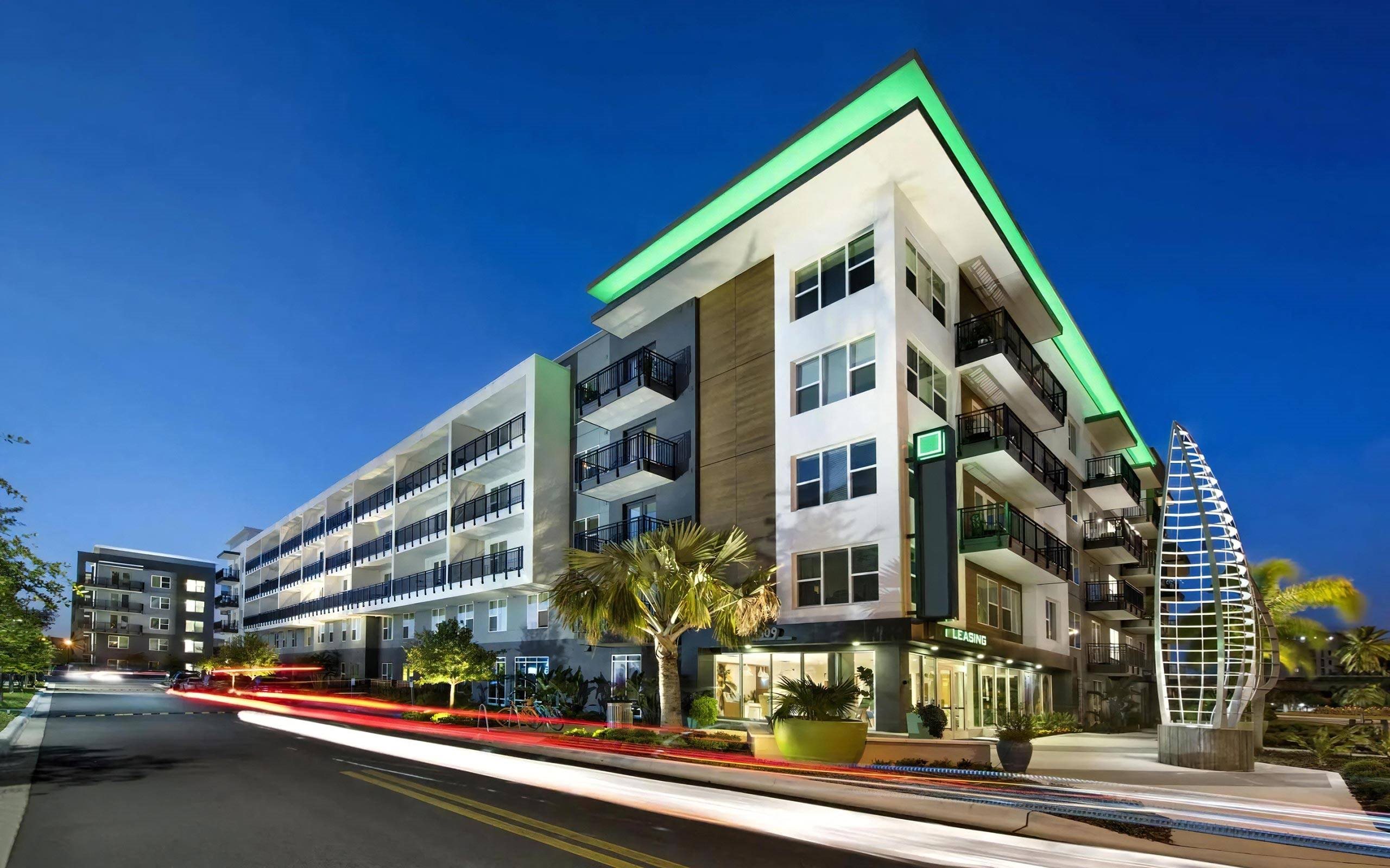 Anchor Riverwalk Entrance Featuring Illuminated Sculpture and Modern Leasing Center
