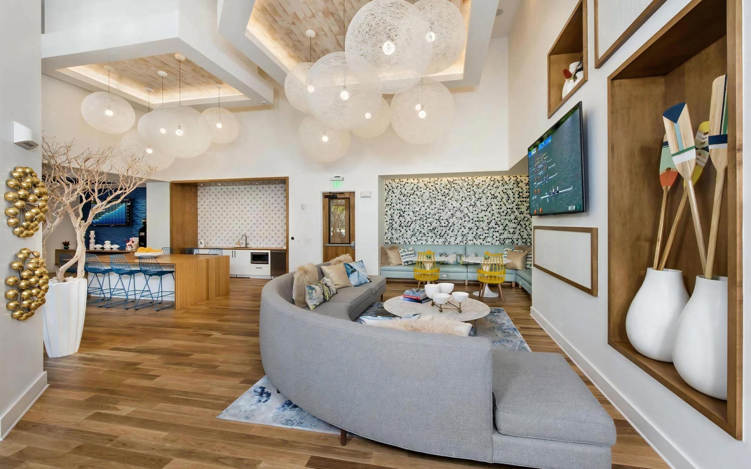 Community Lounge with TV, Kitchenette, and Contemporary Decor Accents