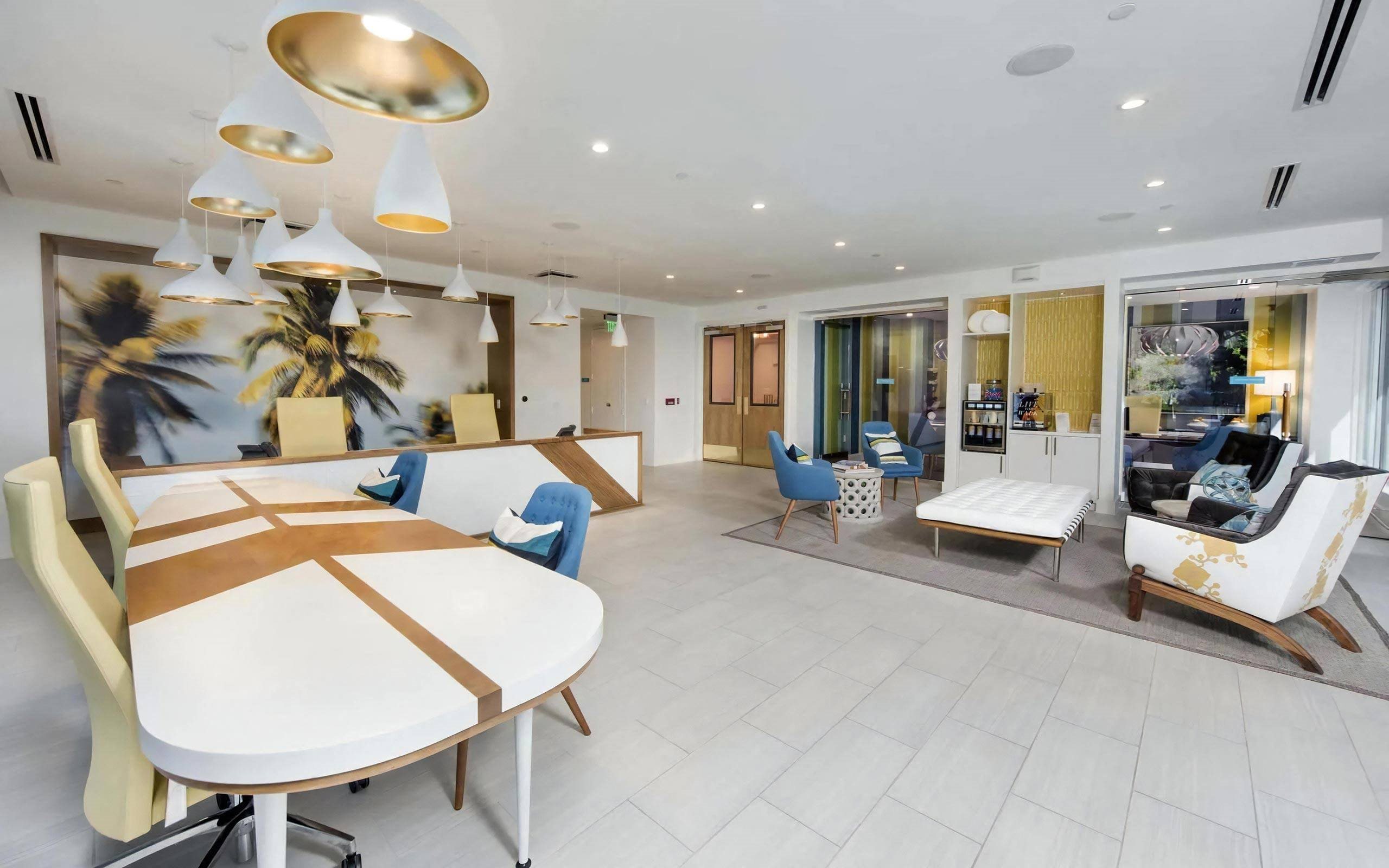 Leasing Office with Modern Desks, Lounge Seating, and Coffee Bar
