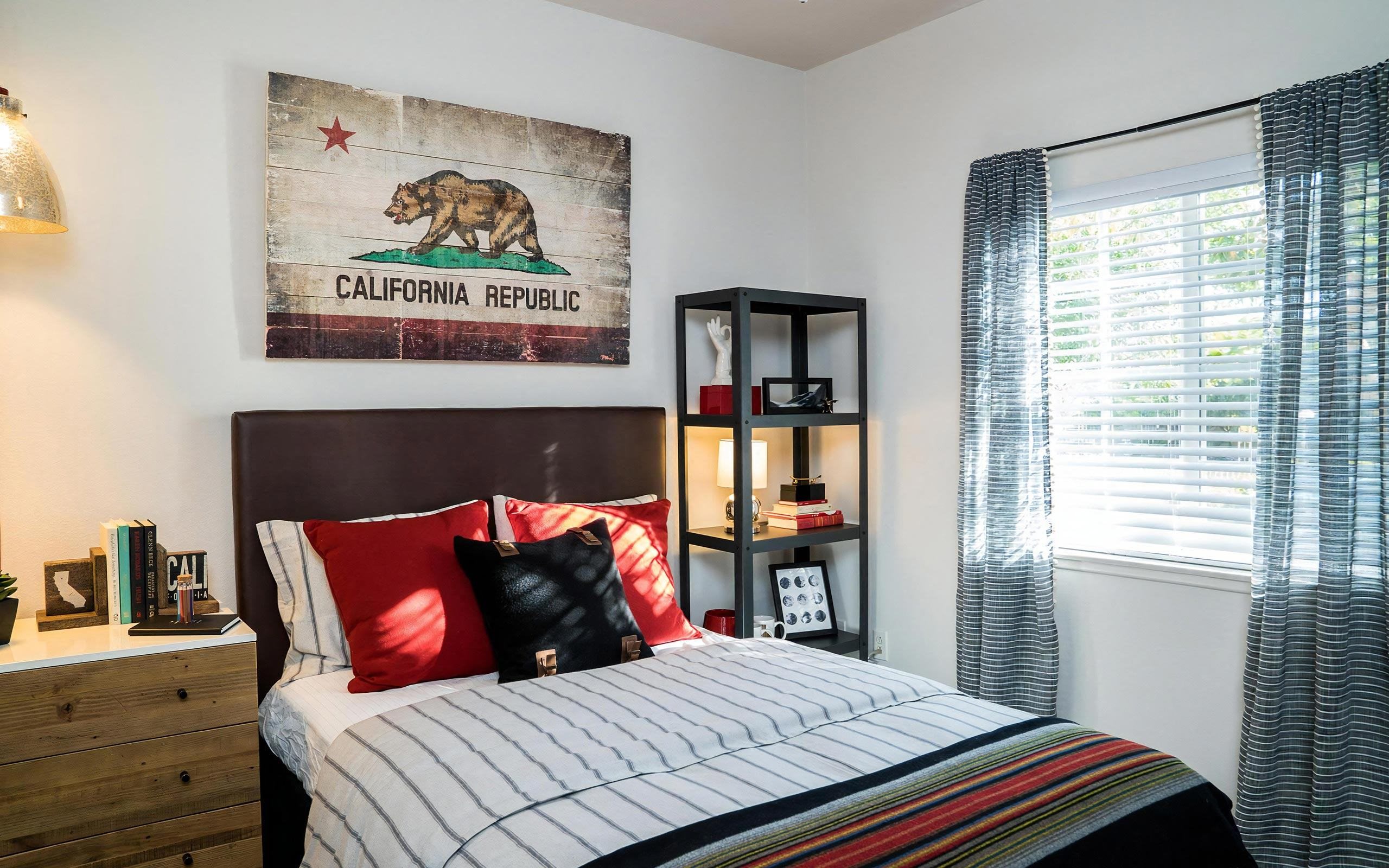 Guest Bedroom with Framed Wall Decor and Natural Lighting