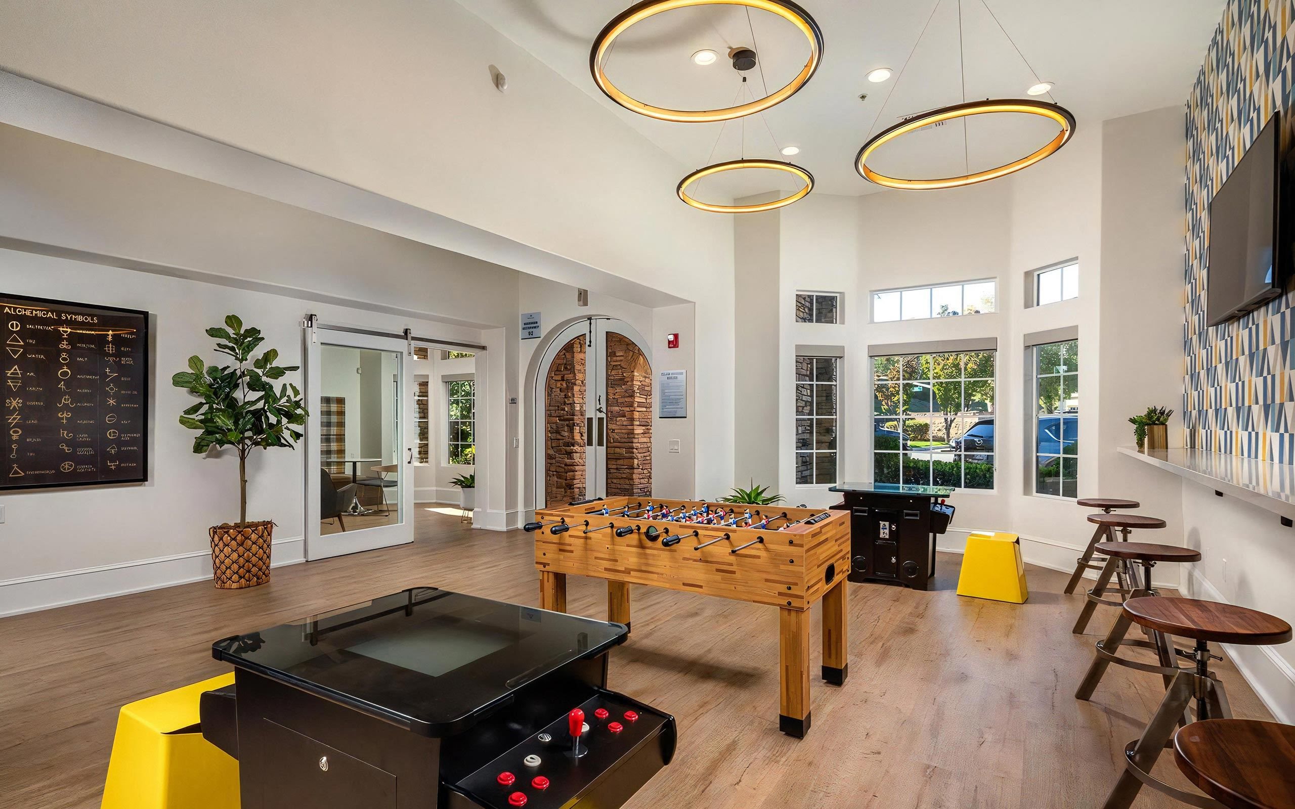Resident Game Room With Foosball, Arcade, And Lounge Seating