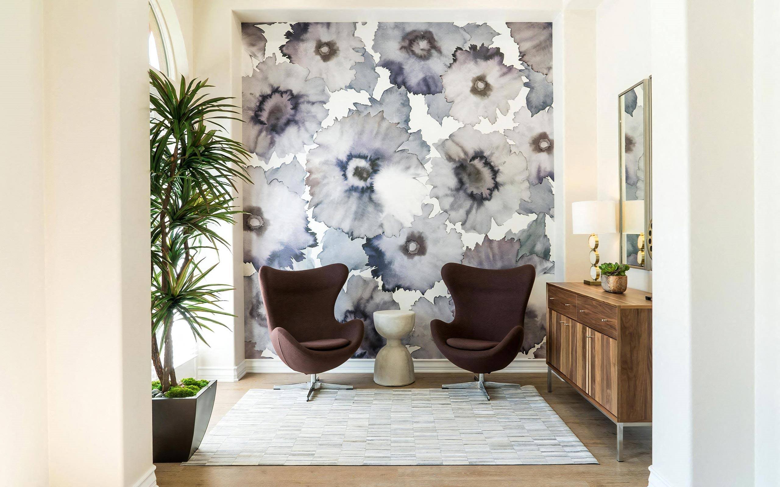 Cozy Seating Area With Bold Floral Wallpaper and Accent Chairs