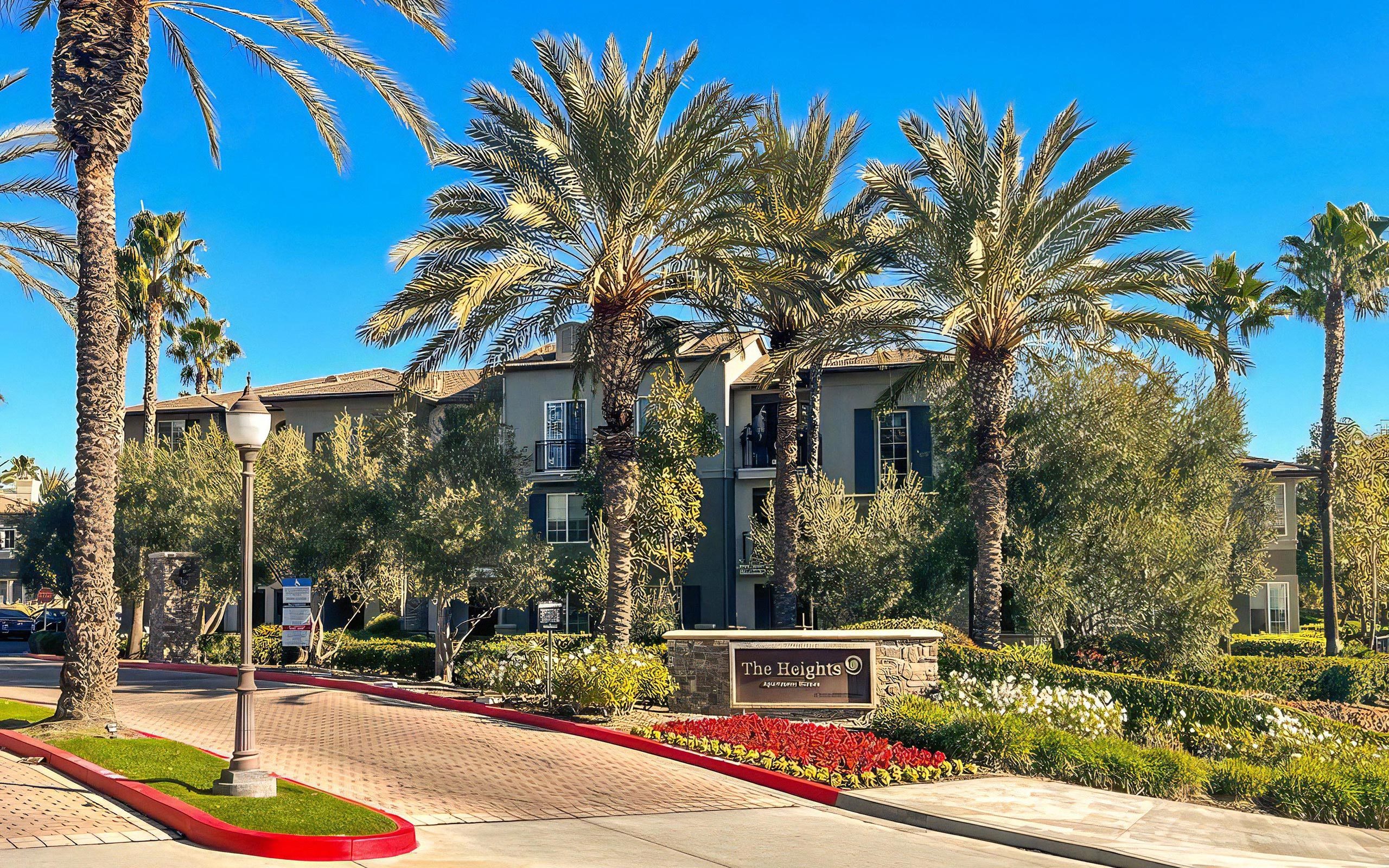 Gated Entry With Lush Landscaping and Welcome Sign