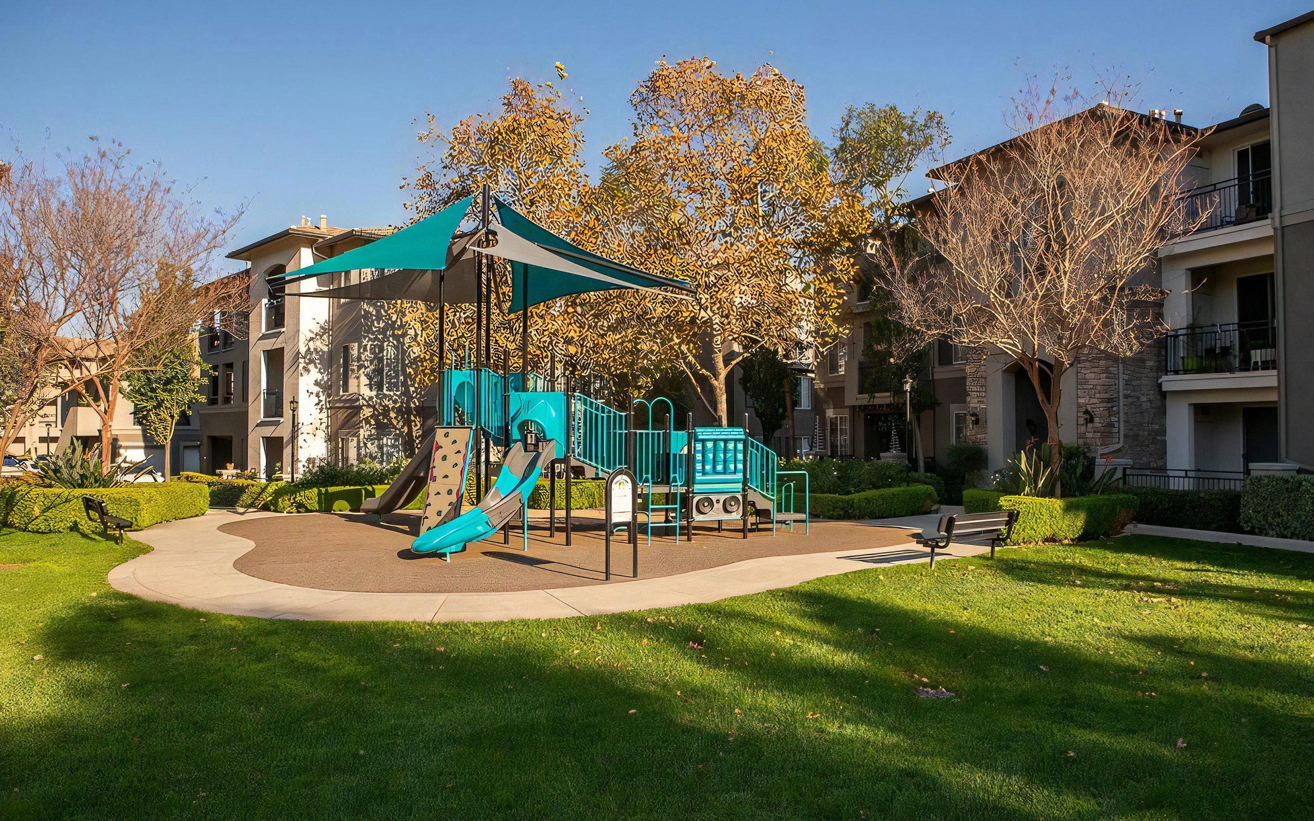 Colorful Children’s Play Area With Slides and Climbing Wall