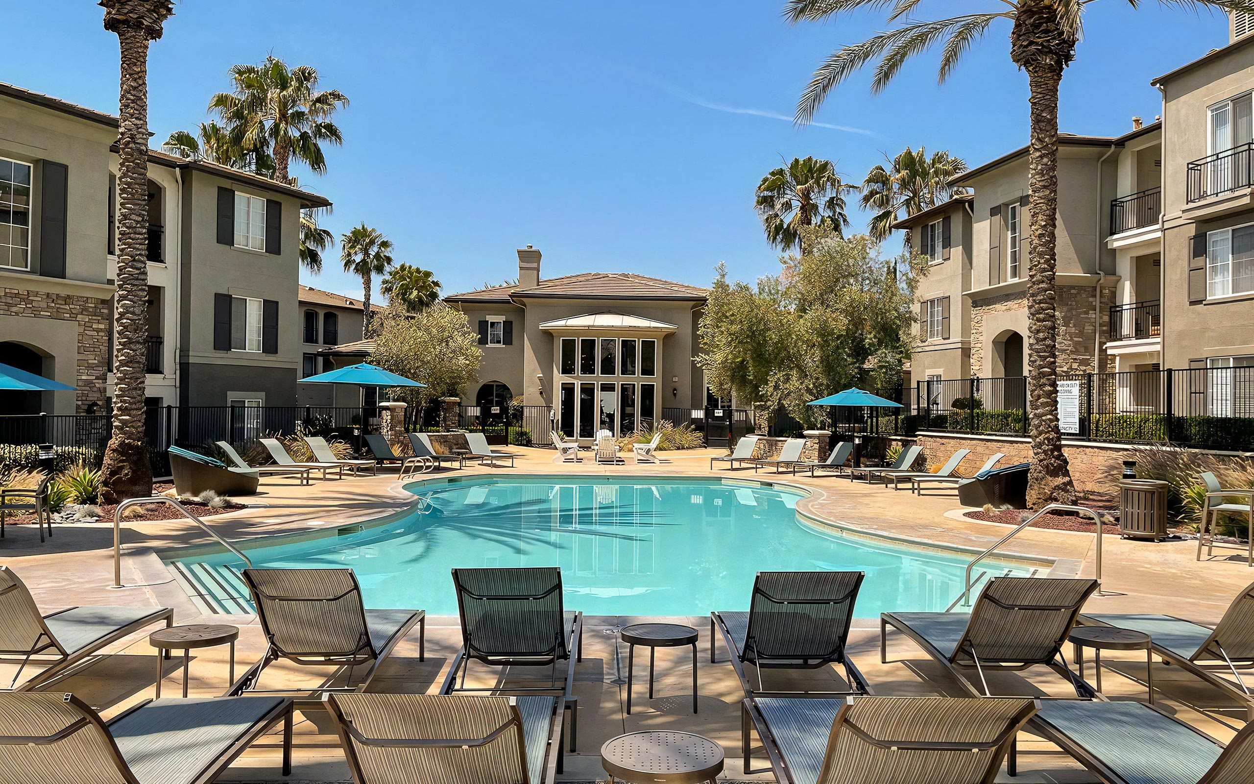 Outdoor Pool Surrounded by Cabanas and Relaxation Areas