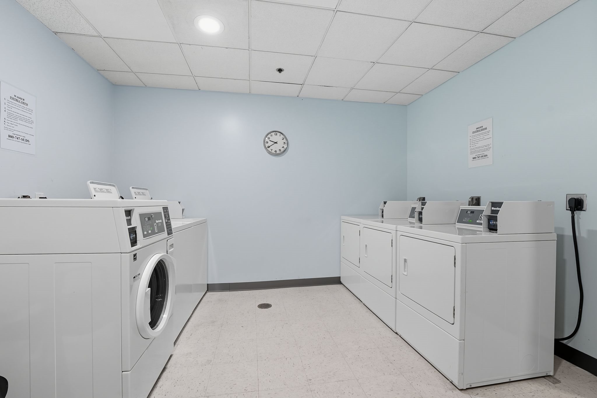 A laundromat with washers and dryers.