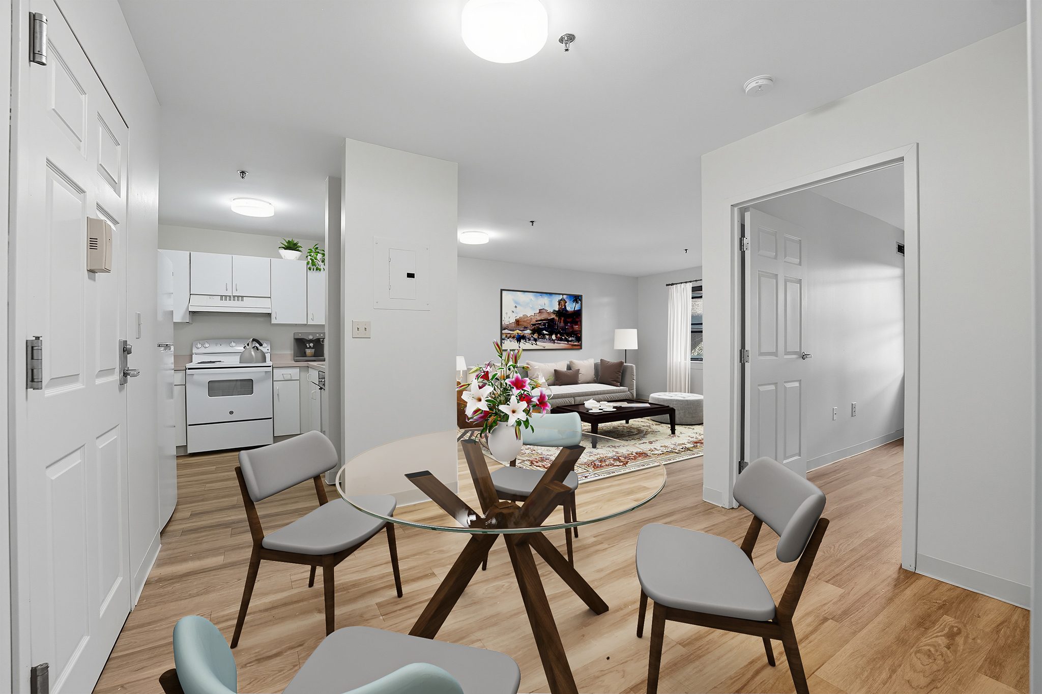 A modern kitchen with a dining table set for four.