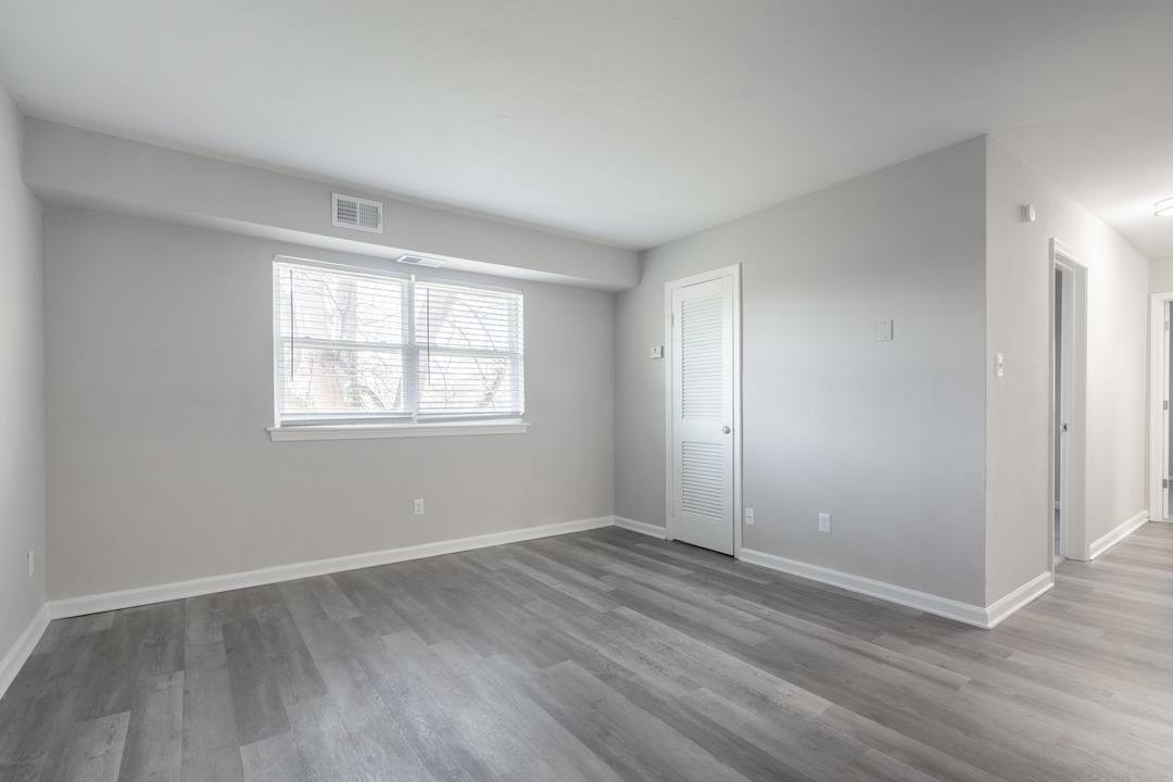 A room with a window and a door.
