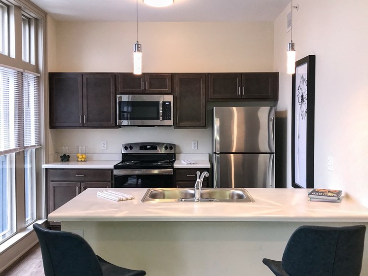 Apartment kitchen area and breakfast bar-The Arts Lofts at Dayton Arcade, Dayton, OH
