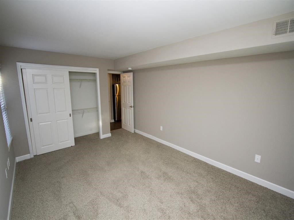 Apartment bedroom with carpet floors-Quality Hill Square, Kansas City, MO