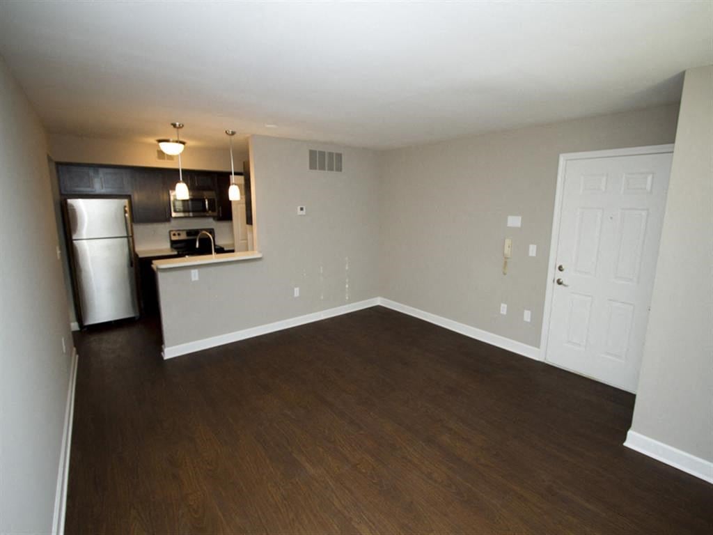 Apartment living room area with hardwood floors-Quality Hill Square, Kansas City, MO