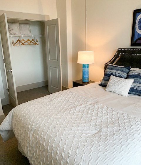 Apartment bedroom and closet-The Arts Lofts at Dayton Arcade, Dayton, OH