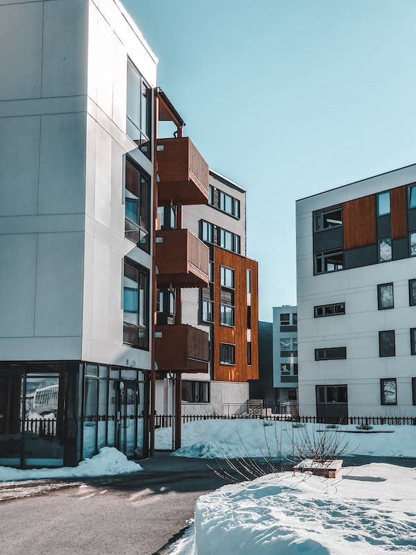 a group of modern buildings in the snow