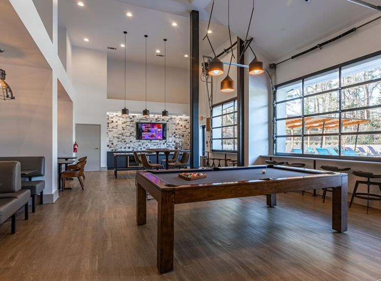 Clubhouse, pool table, window seats, lounging area.
