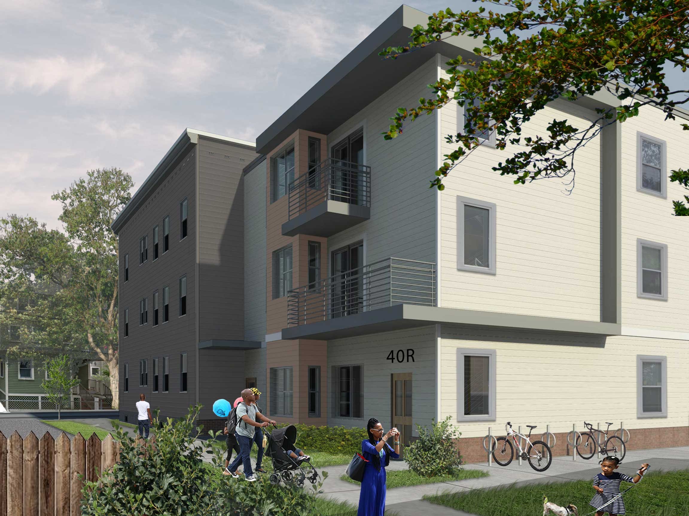 Beautiful greenspace behind a 3 story building with balconies