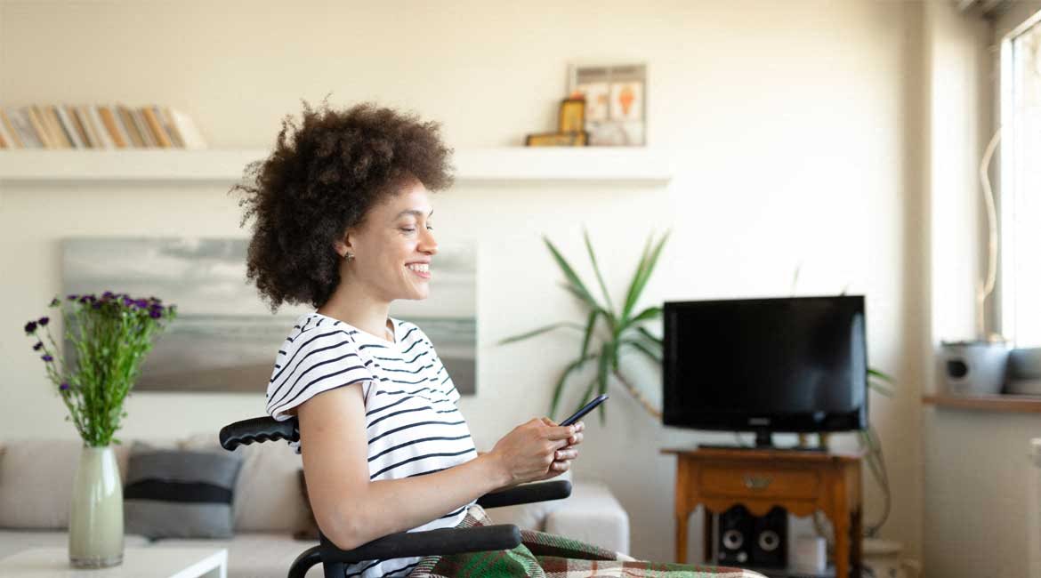 Woman enjoying her home, in a wheelchair .