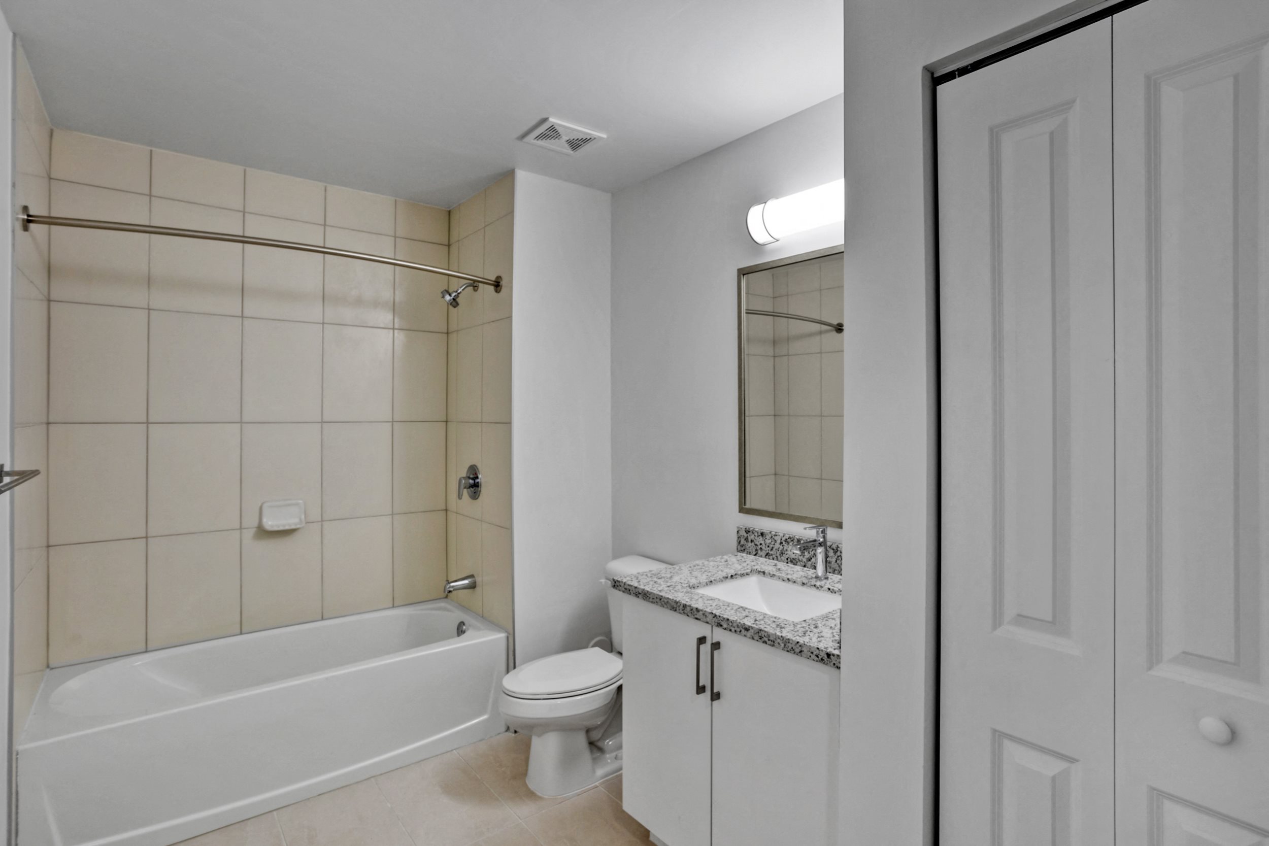 a bathroom with a toilet sink and bathtub