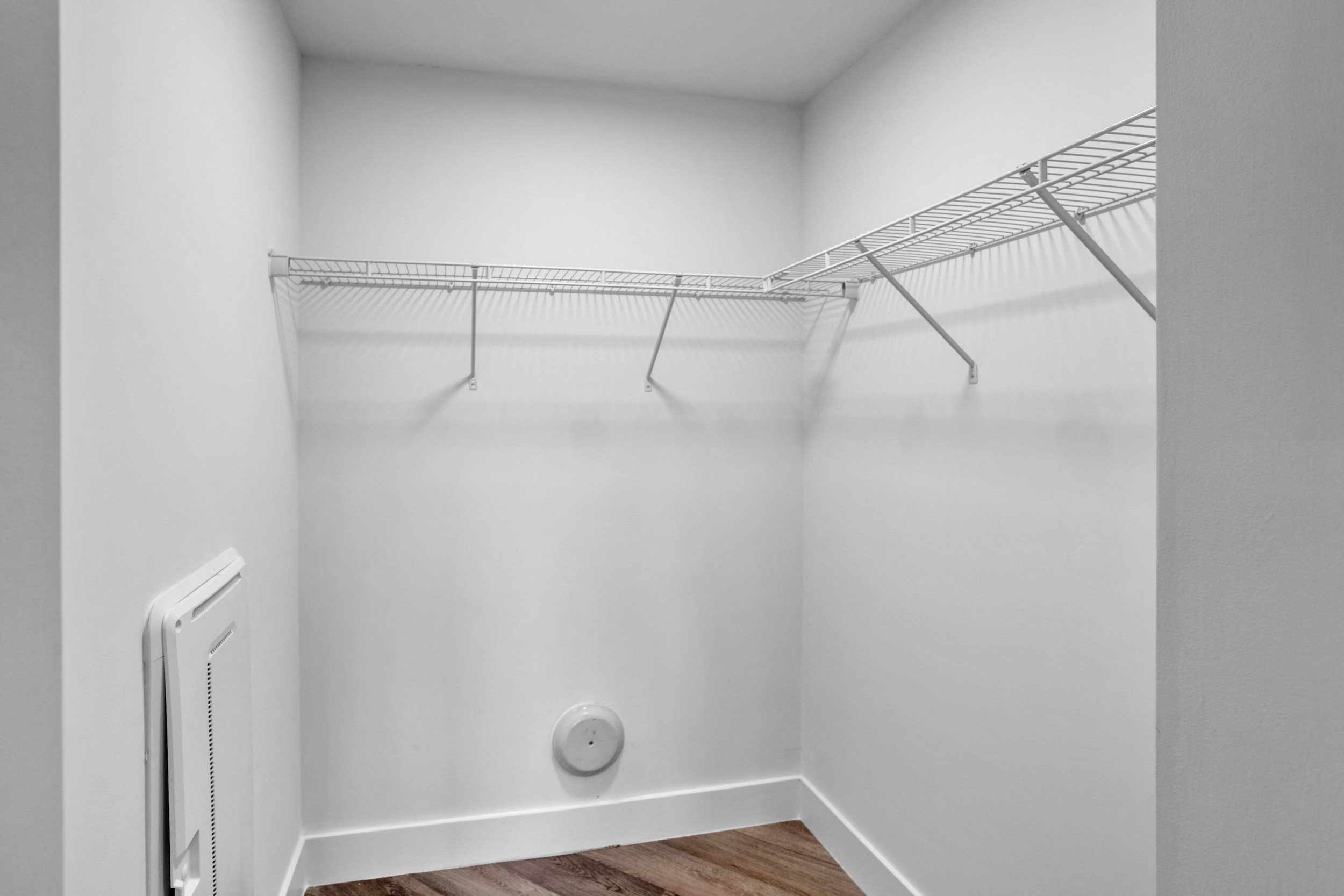 a bedroom with a medium sized bed and a ceiling fan