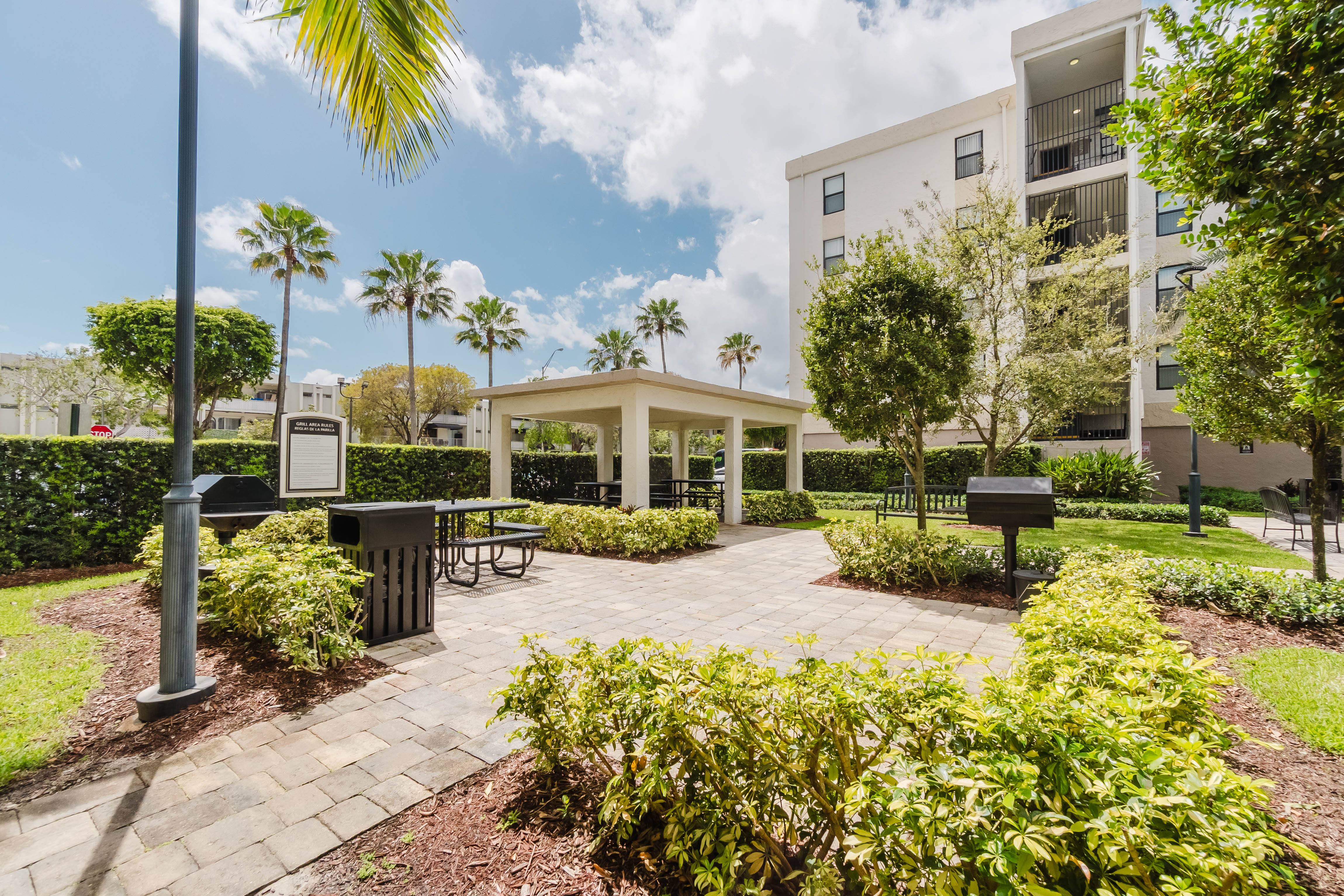A sunny day at the outdoor seating area of a modern building.