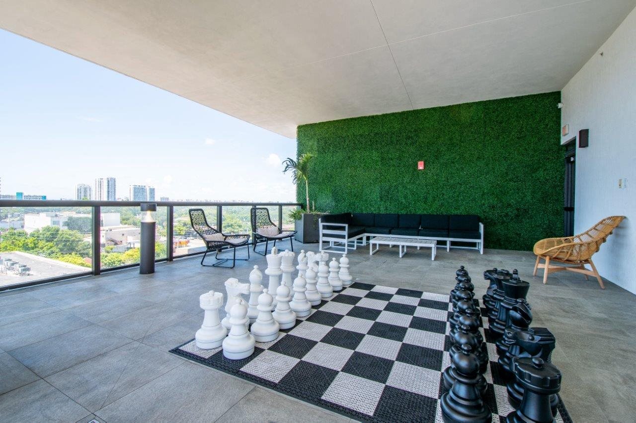 a game room with a chess set and a large chess board
