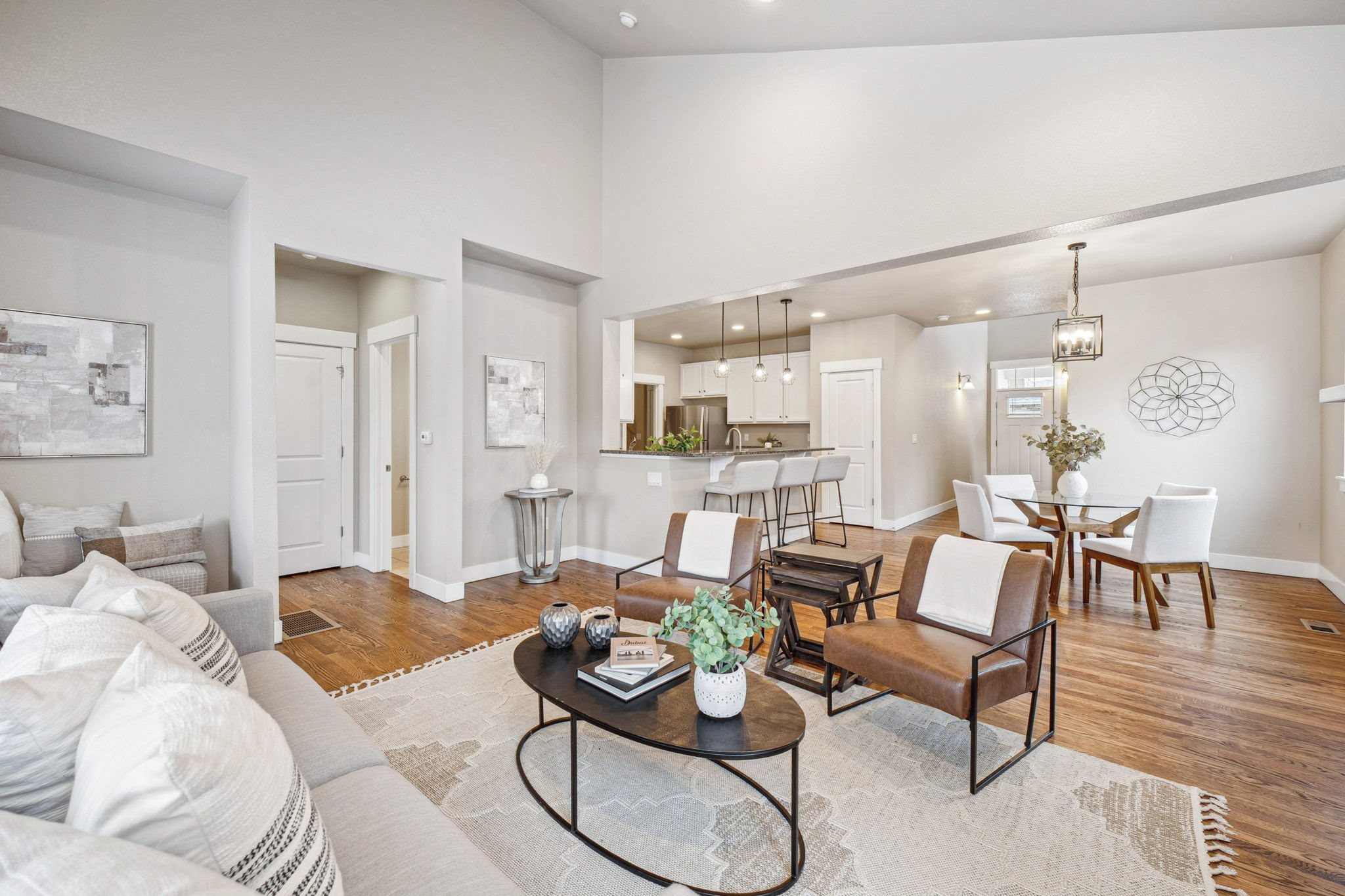 A living room with a white couch and a coffee table.